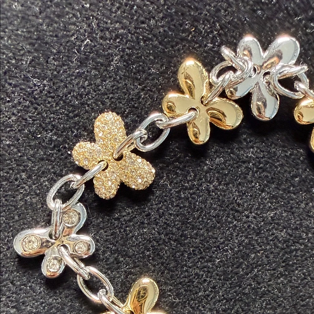 Coach Two-Tone Floral Charm Bracelet in Gold and Silver